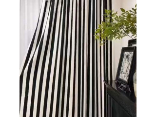 Like the look? Voila Voile's black and white striped curtains provide a pop to every room!